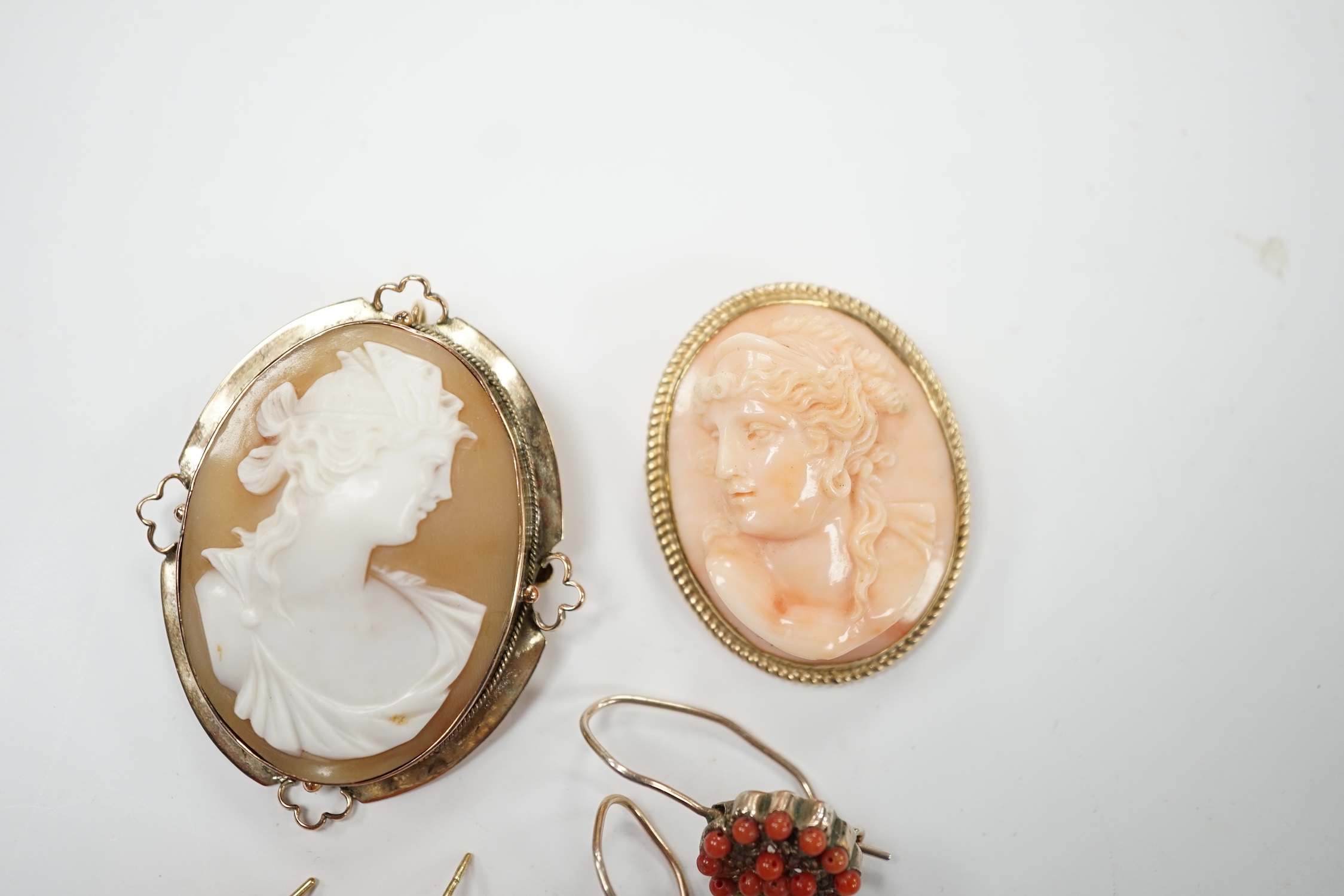 Two pairs of yellow metal and coral set earrings including carved bust (one badly chipped) and two 9ct mounted cameo shell/coral brooches. Poor condition.